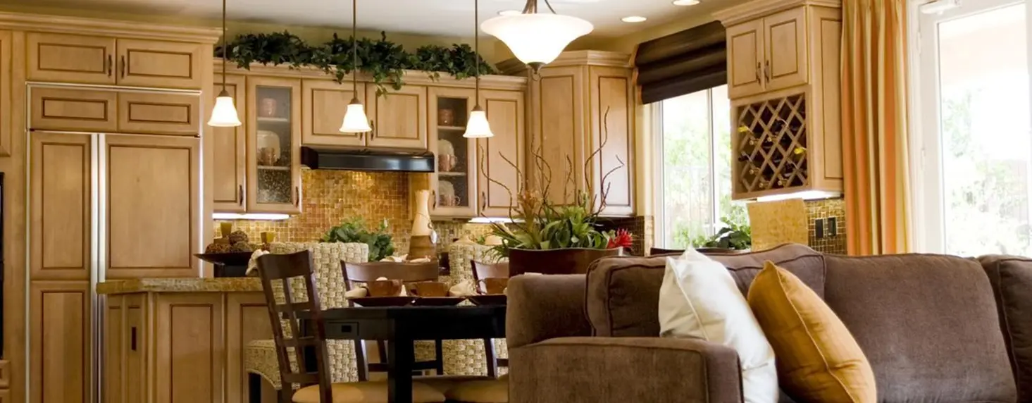 Modern kitchen and living room with decor.