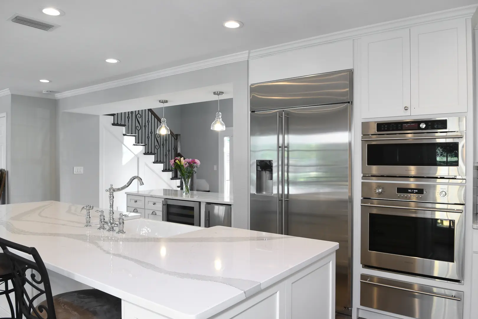 Modern kitchen with stainless steel appliances.
